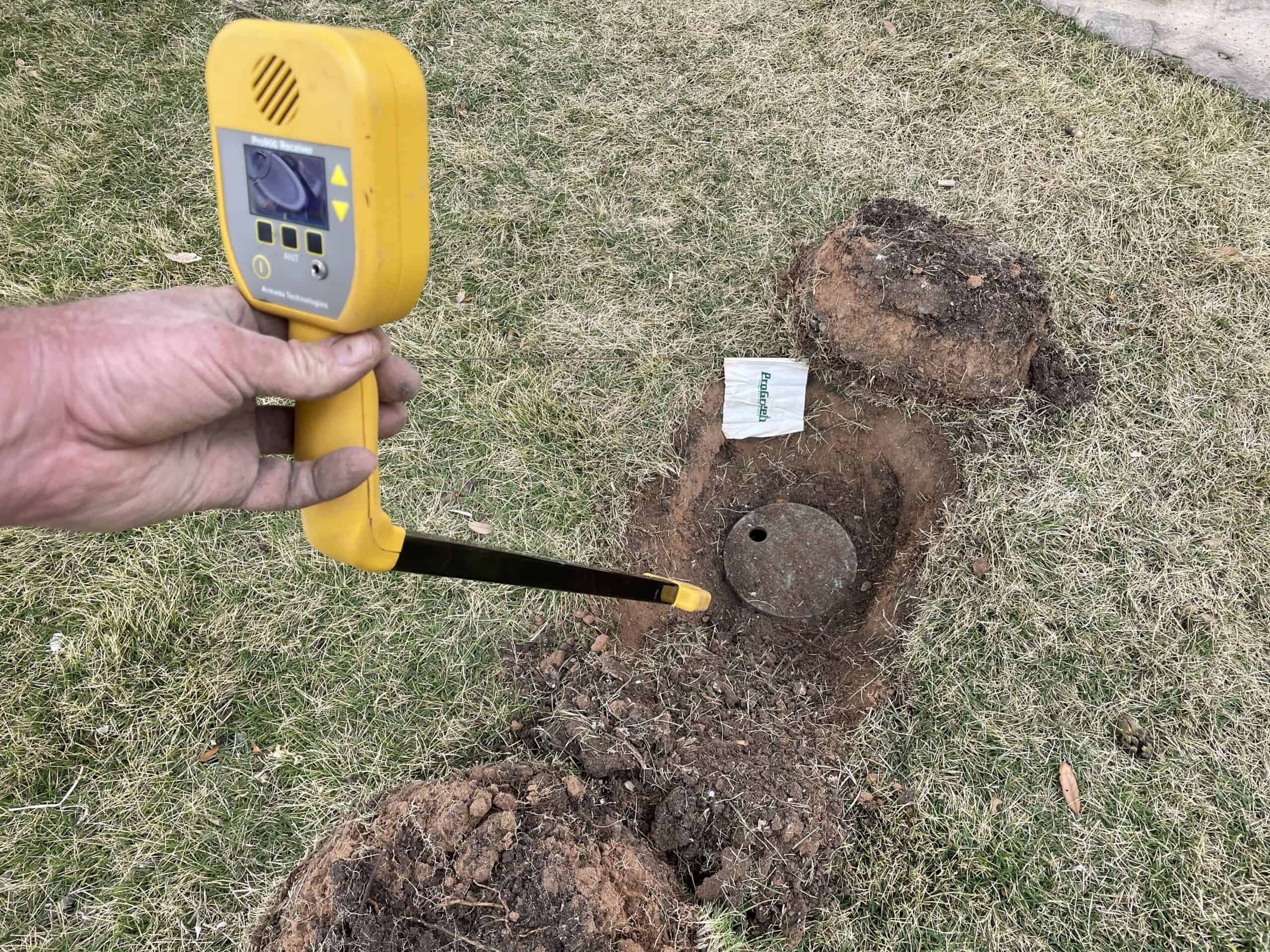 An irrigation repair technician at work