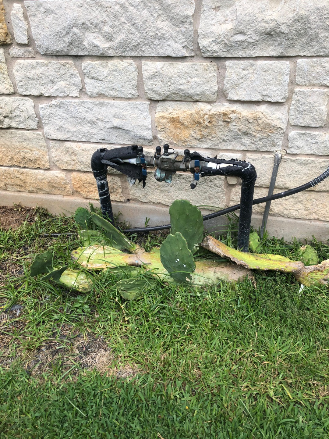 An irrigation control system by the side of a house