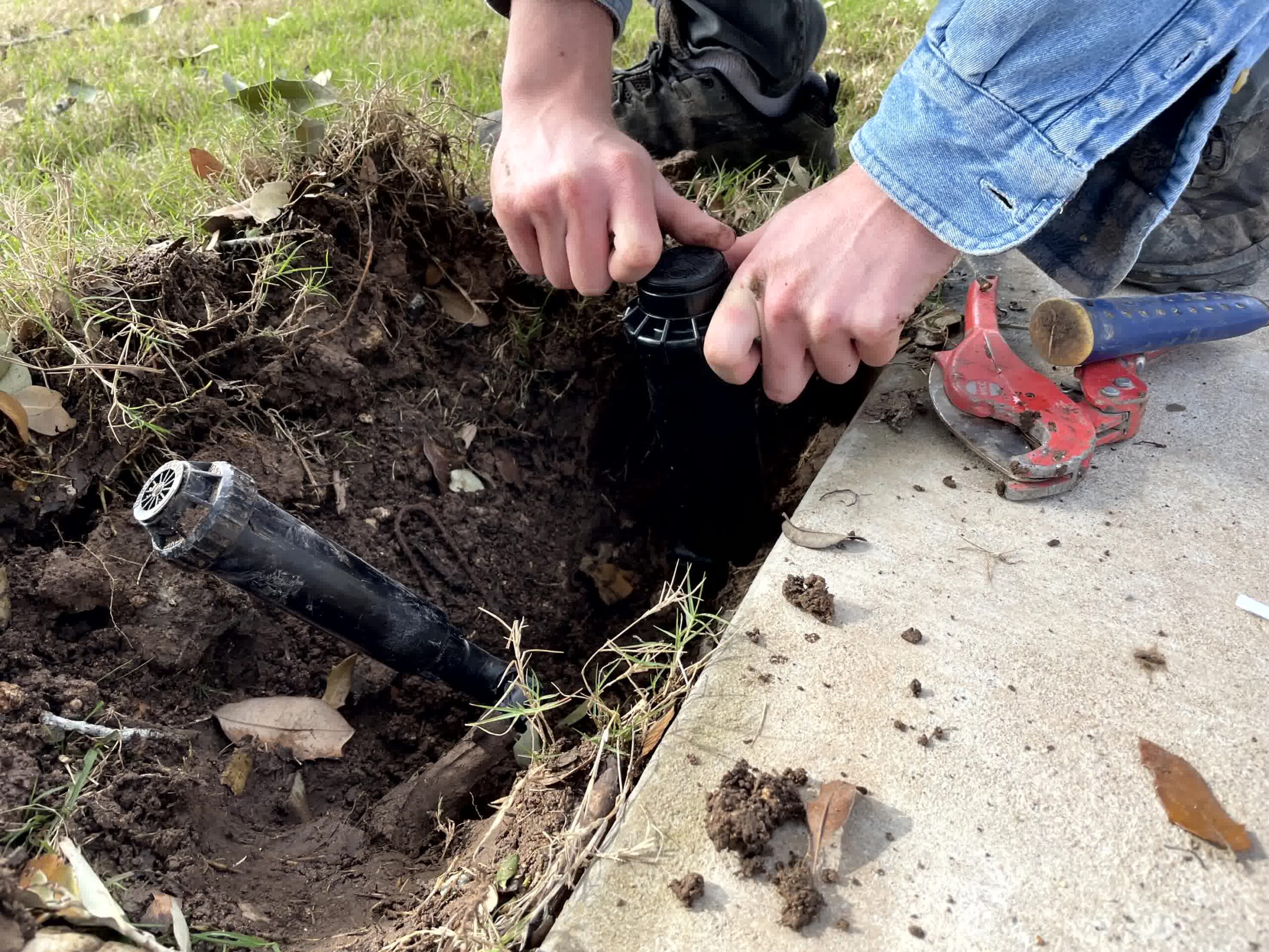 An expert taking care of an irrigation repair job.