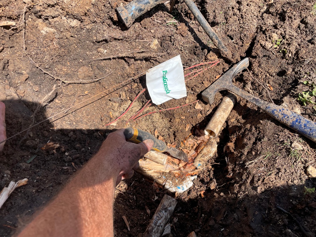 A professional taking care of an irrigation repair.