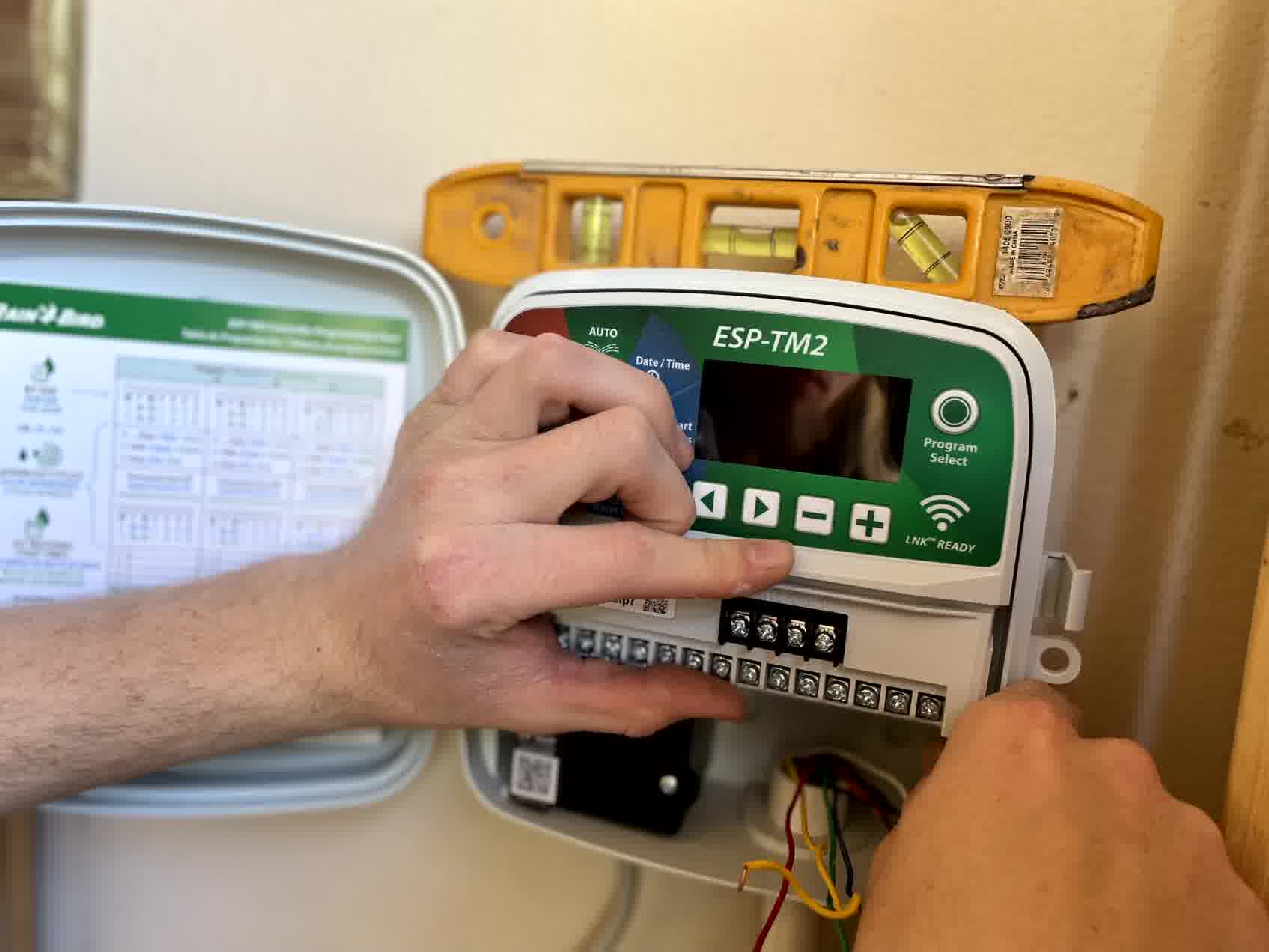 One of our professional irrigation technicians is handling a Rain Bird irrigation system.
